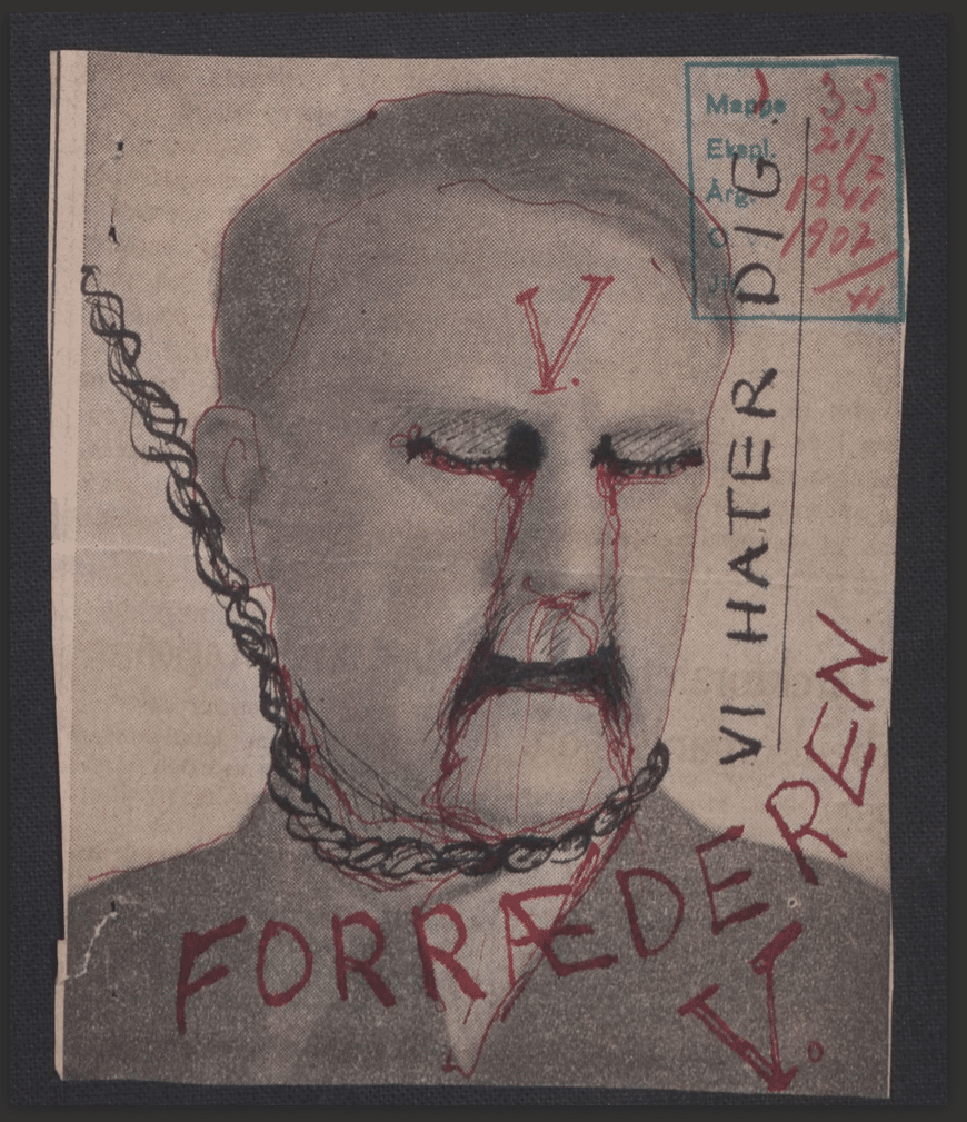Avisutklipp av Vidkun Quisling, som er overtegnet med røde streker, tårer og teksten «forræder» og «vi hater deg».